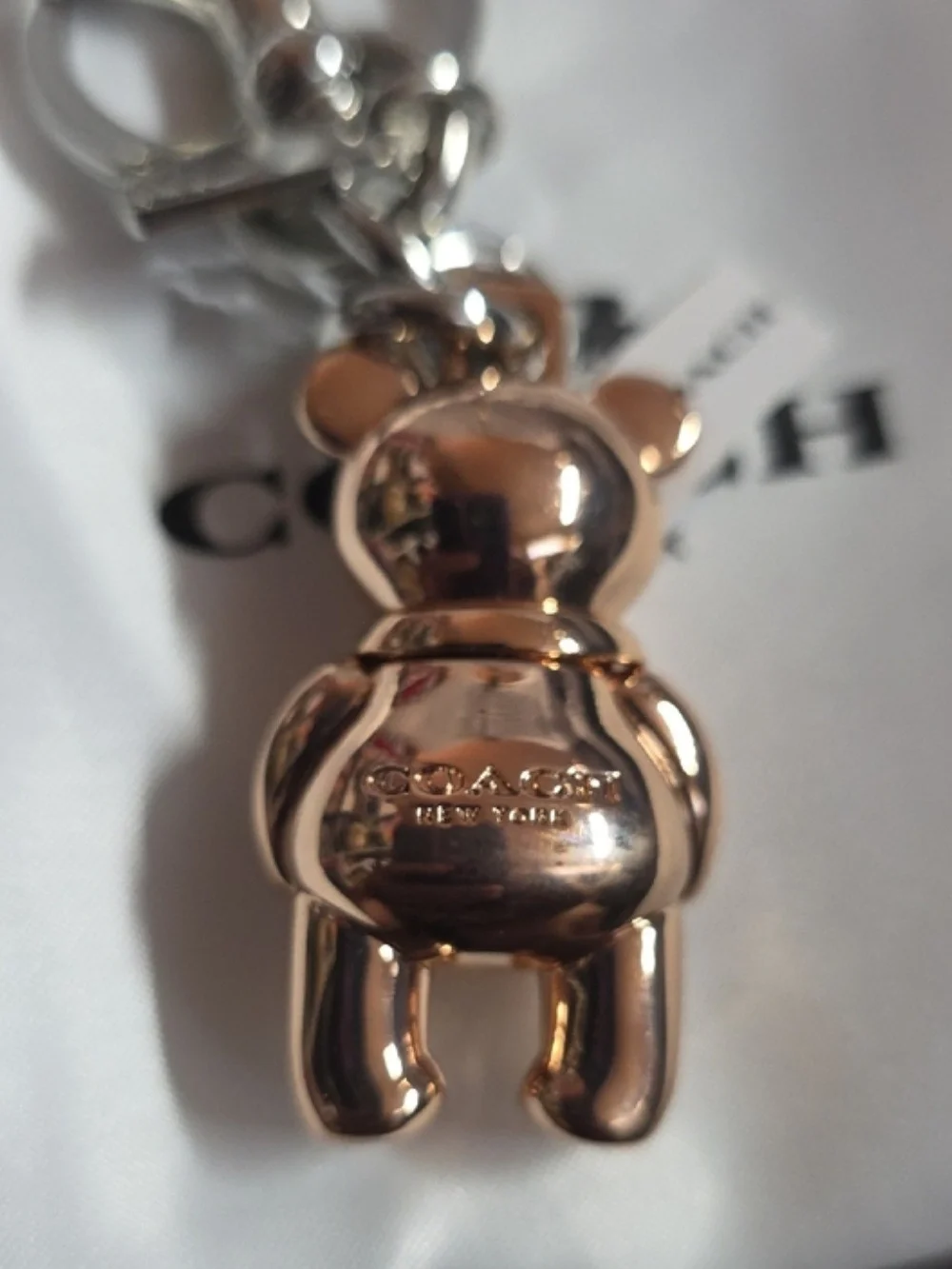 The official Rose Gold Coach 3D Mascot Bear Bag Charm & Keychain